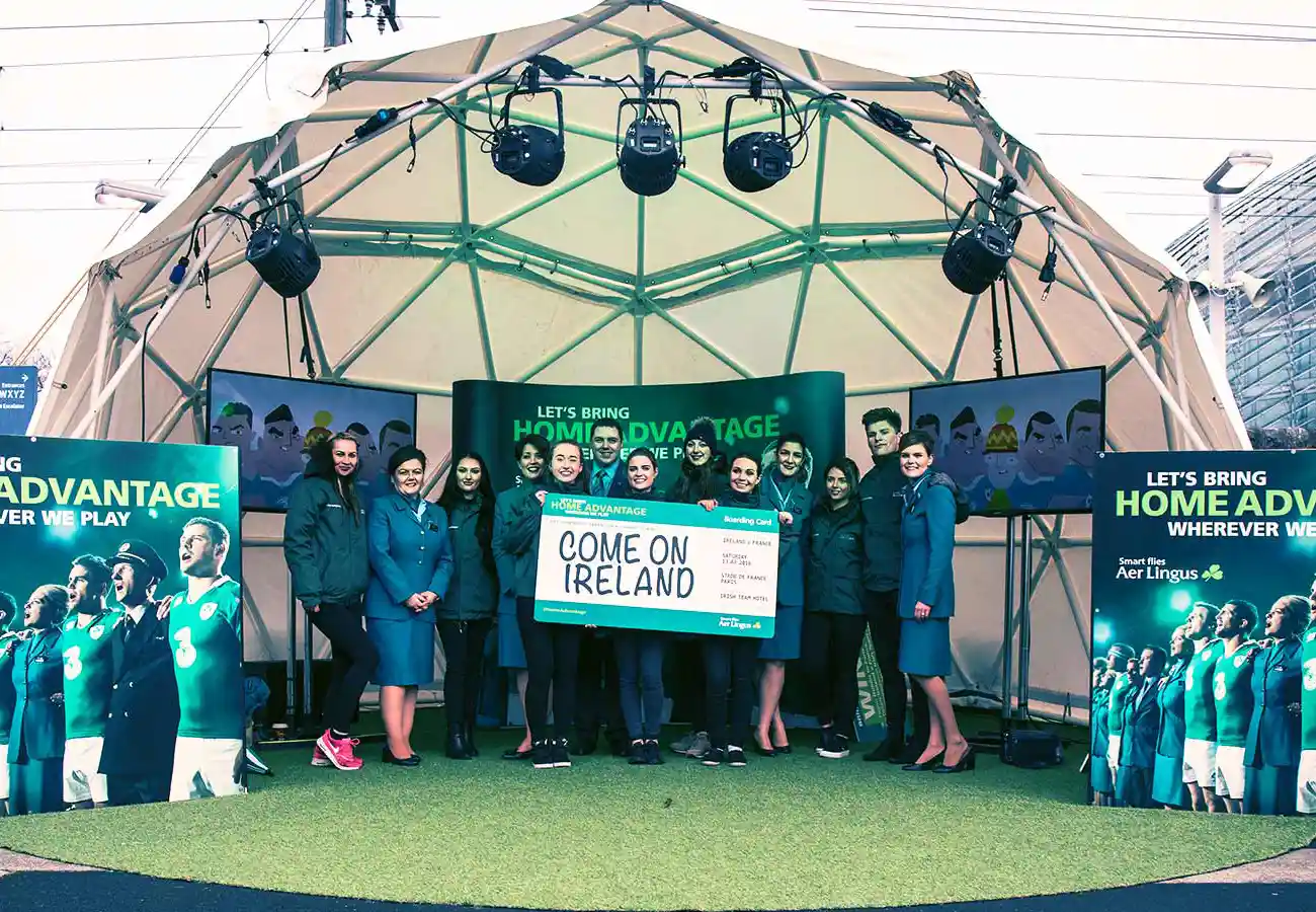 Aer Lingus Irish Rugby Brand Activation dome with group of people holding banner