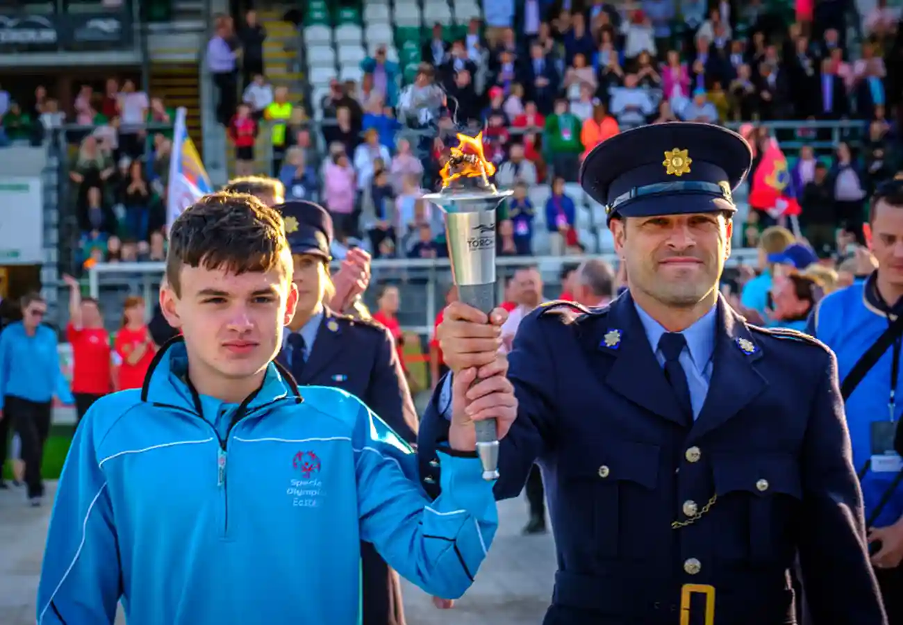 Holding torch Special Olympics