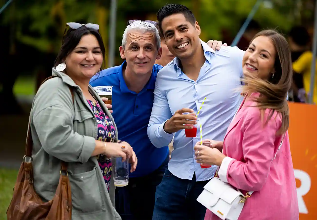People smiling at camera at SAP 25 Anniversary Galway